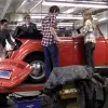 Students studying climate change create an electric car.