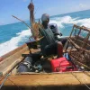 A Barbudan fisherman with a fresh lobster catch!