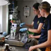 Graduate students Danielle Young from Temple University and Dannise Ruiz from Penn State preparing oil and dispersant solutions for exposure experiments with deep sea corals aboard the exploration vessel E/V Nautilus.