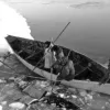 eskimos land a skin boat in the ice