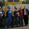 Students studying climate change pose for a photo at a NOAA facility.