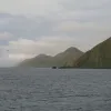 The Macquarie Island site in Australia was inscribed on the World  Heritage List in 1997. The island is the exposed crest of the undersea  Macquarie oceanic ridge, raised to its present position where the  Indo-Australian tectonic plate meets the Pacific p