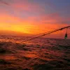 Sunset over a fishing net. 