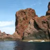 The Gulf of Porto: Calanche of Piana, Gulf of Girolata, Scandola Reserve  site in France was inscribed on the World Heritage List in 1983. The  site's vegetation is an outstanding example of scrubland. Seagulls,  cormorants, and sea eagles can be found here, while the clear waters,  with their islets and inaccessible caves, host a rich and diverse marine  life.