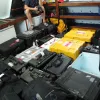 Brian Skerry in a room with all his photography equipment cases.