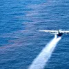 A C-130 Hercules from the Air Force Reserve Command deploys dispersant into the Gulf of Mexico May 5, 2010, as part of the Deepwater Horizon/BP oil spill response effort. 
