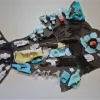 The Fish Bite Fish is made exclusively from pieces of plastic that washed ashore with bite marks from fish and other animals to make the point that animals trying to eat floating plastic is a real problem.