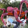 A sculpture of a giant octopus made of ocean debris