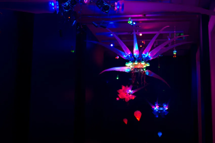A photo of a 2011 installation by artist Shih Chieh Huang, featuring his illuminated creations made from everyday objects.