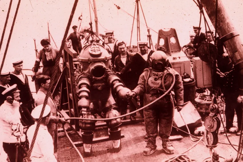 Two divers prepare to explore the Lusitania shipwreck in 1935.