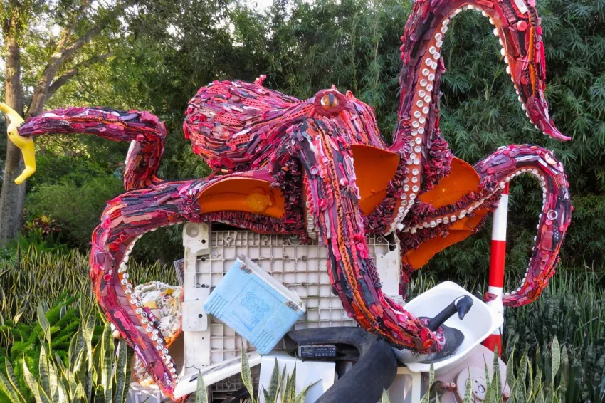 A sculpture of a giant octopus made of ocean debris