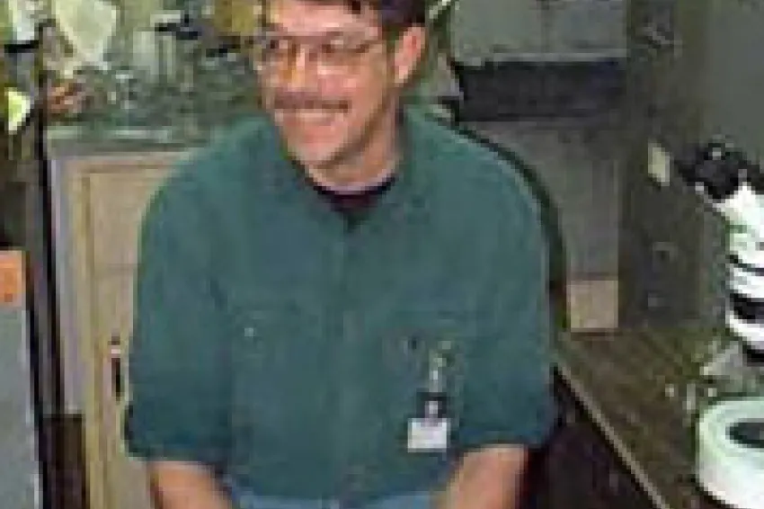 Michael Vecchione sitting in a lab.