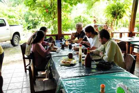 Smithsonian researchers eat a meal in preparation for a fossil excavation