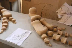 Carved flipper bones made of wood.