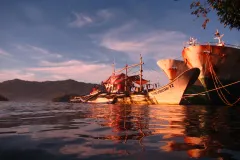 "Pirate fishing vessel converted to a home in Lembeh Strait off North Sulawesi, Indonesia," wrote Claire Fackler of her winning image.