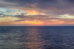 An orange sunset over the ocean.