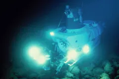 The research submersible Alvin uses bright lights to illuminate the dark seafloor.