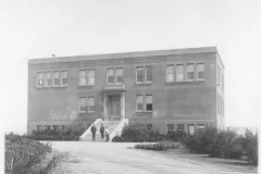 Black and white image of brick building.