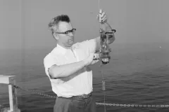 a scientists conduct and experiment on a ship