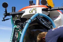 Submarine pilot&nbsp;Bruce Brandt secures&nbsp;ARMS&nbsp;to the outside of the submersible Curasub so it can deploy ARMS on the seafloor.
