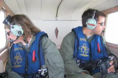 New England Aquarium researchers Dr. Moira Brown and Yan Guilbault conducting aerial surveys for North Atlantic right whales over the Roseway Basin, Canada.