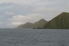 The Macquarie Island site in Australia was inscribed on the World  Heritage List in 1997. The island is the exposed crest of the undersea  Macquarie oceanic ridge, raised to its present position where the  Indo-Australian tectonic plate meets the Pacific p