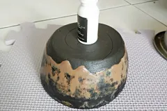 an upside down bowl and a glue bottle
