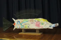 A four-foot long fish sculpture has fins and tail made with recycled rakes. 
