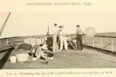 black and white photo of workers aboard the deck of a vessel