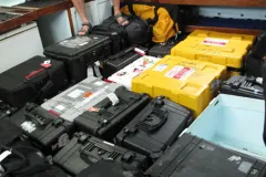 Brian Skerry in a room with all his photography equipment cases.