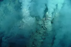 towers spew white smoke underwater