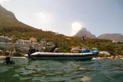 A boat with divers in Clifton Cove