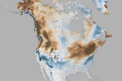 A map of the U.S. and Canada is colored to show the areas of the U.S. that expect higher or lower precipitation. The northwest and northeast are brown to show reduced precipitation, while most of the southwest and southeast are blue to indicate higher precipitation.  