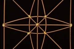 Diagonally crossing sticks in a square frame of sticks. 