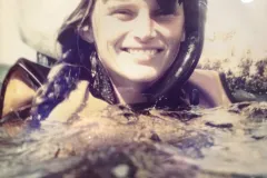 A woman with snorkel gear 