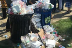 Two overflowing trashcans