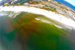 Pink dye was released by CARTHE researchers on the coast of the Gulf of Mexico and its movement tracked using underwater sensors, two small drones, a helicopter and a kite. 