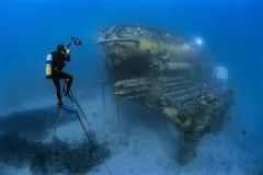 Brian Skerry sits on a 20 foot high underwater tripod to photograph the Aquarius Habitat off Florida.