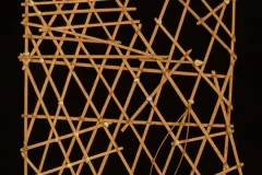 A square of interwoven sticks and cowrie shells