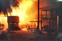 flames engulf several wooden buildings