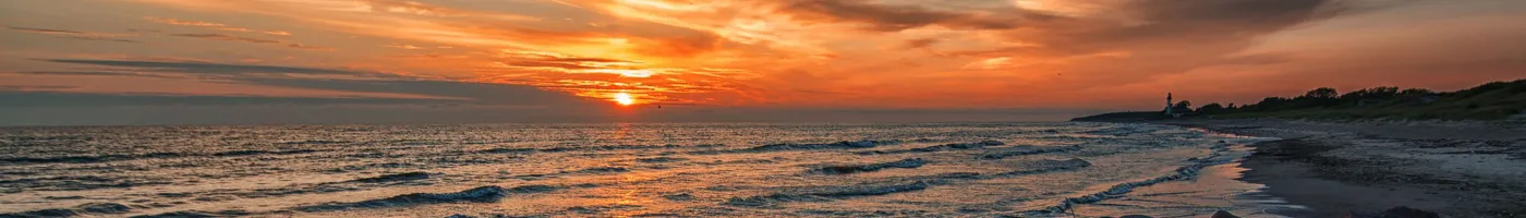 An orange sunset over a beach. 