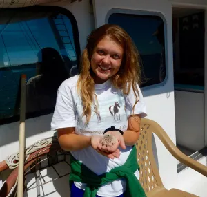 Larisa Bennett shown holding a sea urchin.