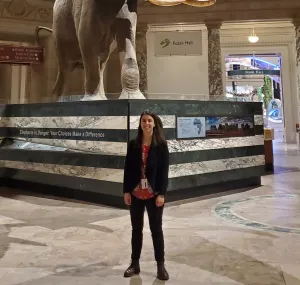 Margaret Osborne stands in front of a taxidermy elephant at the National Museum of Natural History.