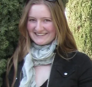 Alena Kuczynski smiling in a headshot