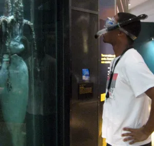 Brandon Adkins wears snorkel gear while looking at exhibits in the Sant Ocean Hall.