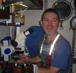 Erik Zettler with a microscope. 