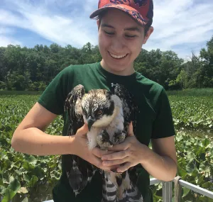 Kalila Morsink holding a bird of prey.