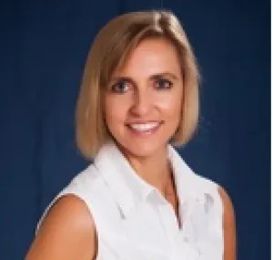 Melanie McField smiling at the camera in a headshot