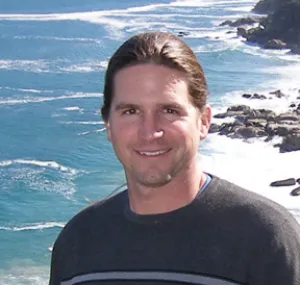 Stuart Sandin standing on the beach. 