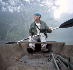 Seabird McKeon kayaking through a mangrove forest.